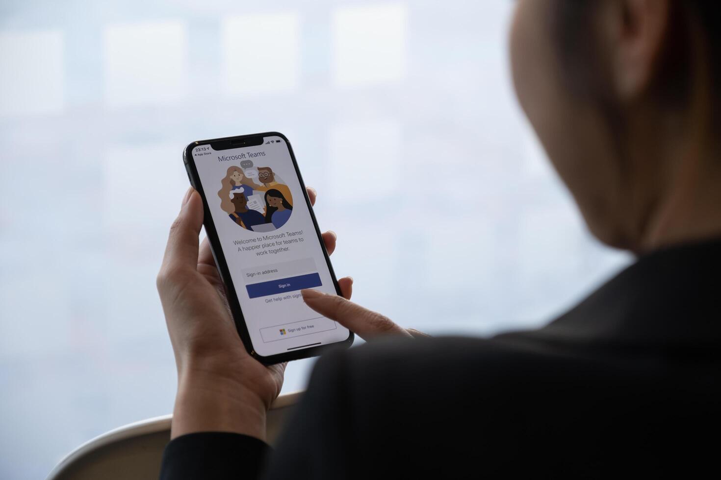 CHIANG MAI, THAILAND - JAN 18, 2021 . A business woman working from home using Microsoft Teams social platform app, ready for conference and meeting at home photo