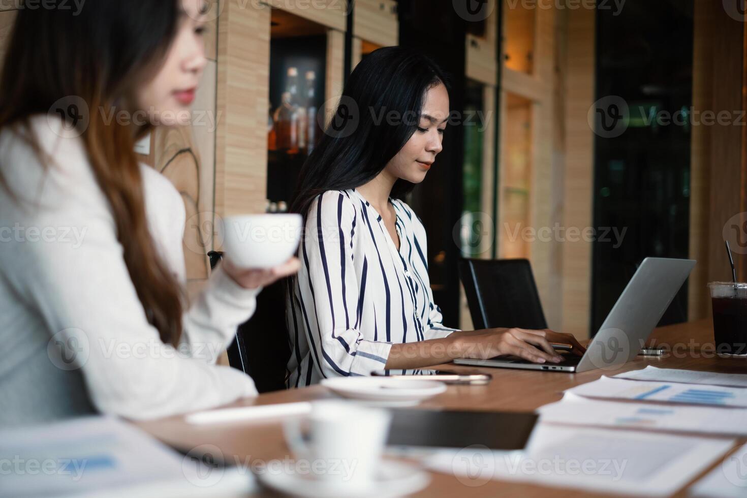 Young woman Accountant and team do audit tax of company by digital tablet in application on cloud with virtual icon on screen. photo