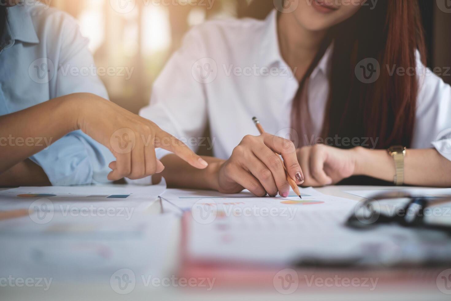 Group of Businesswoman and Accountant checking data document on paperwork for investigation of corruption account . Anti Bribery concept. photo