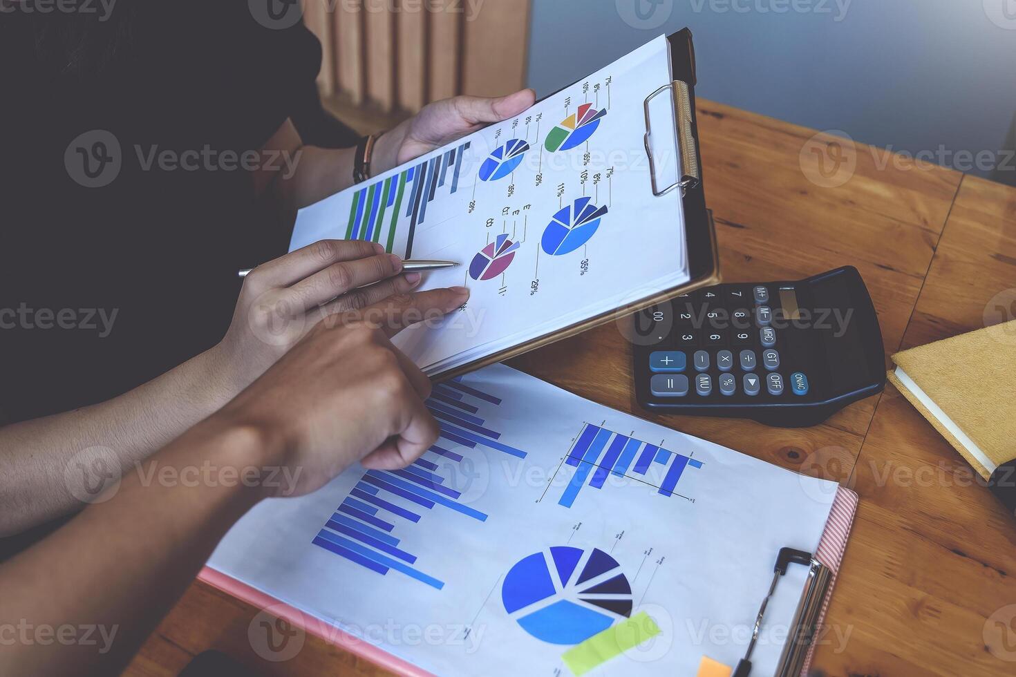 Group of Businesswoman and Accountant checking data document on digital tablet for investigation of corruption account . Anti Bribery concept. photo