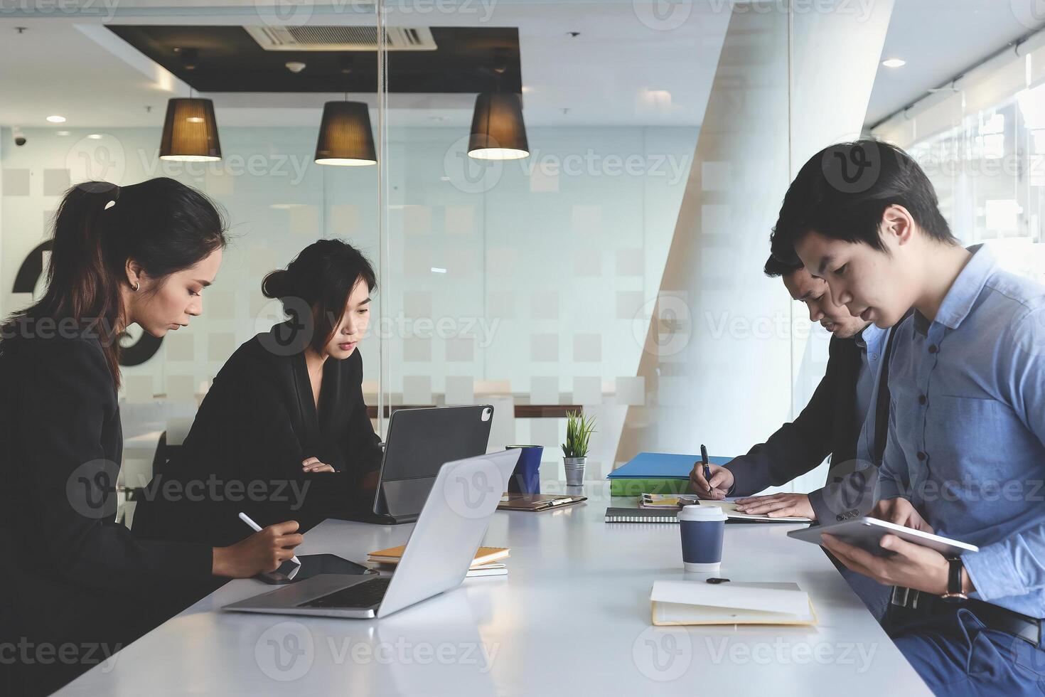 Group of Fund managers researching and analysis Investment stock market by laptop computer. photo