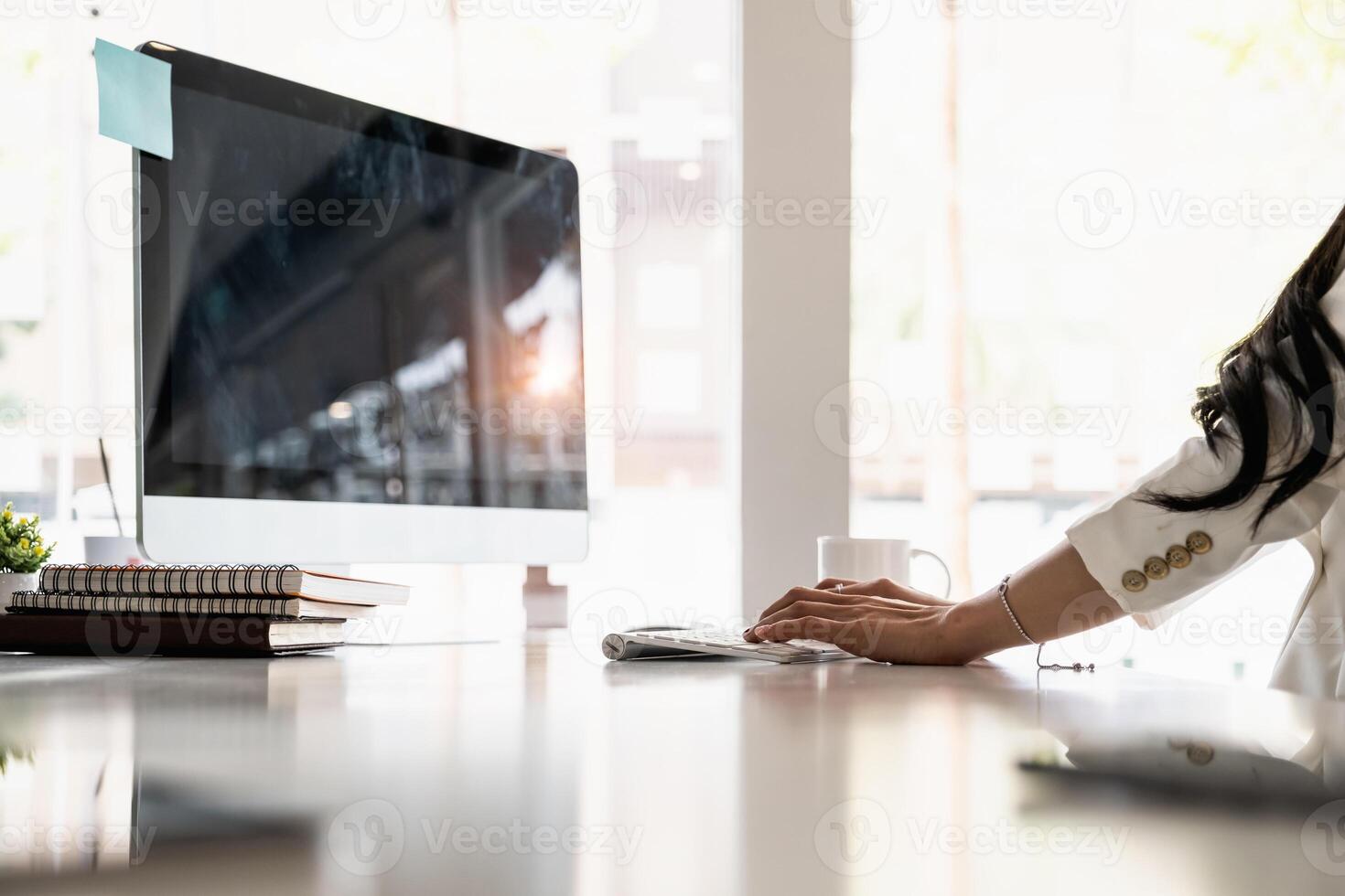 Side view of business woman or accountant working online from home with computer laptop. photo
