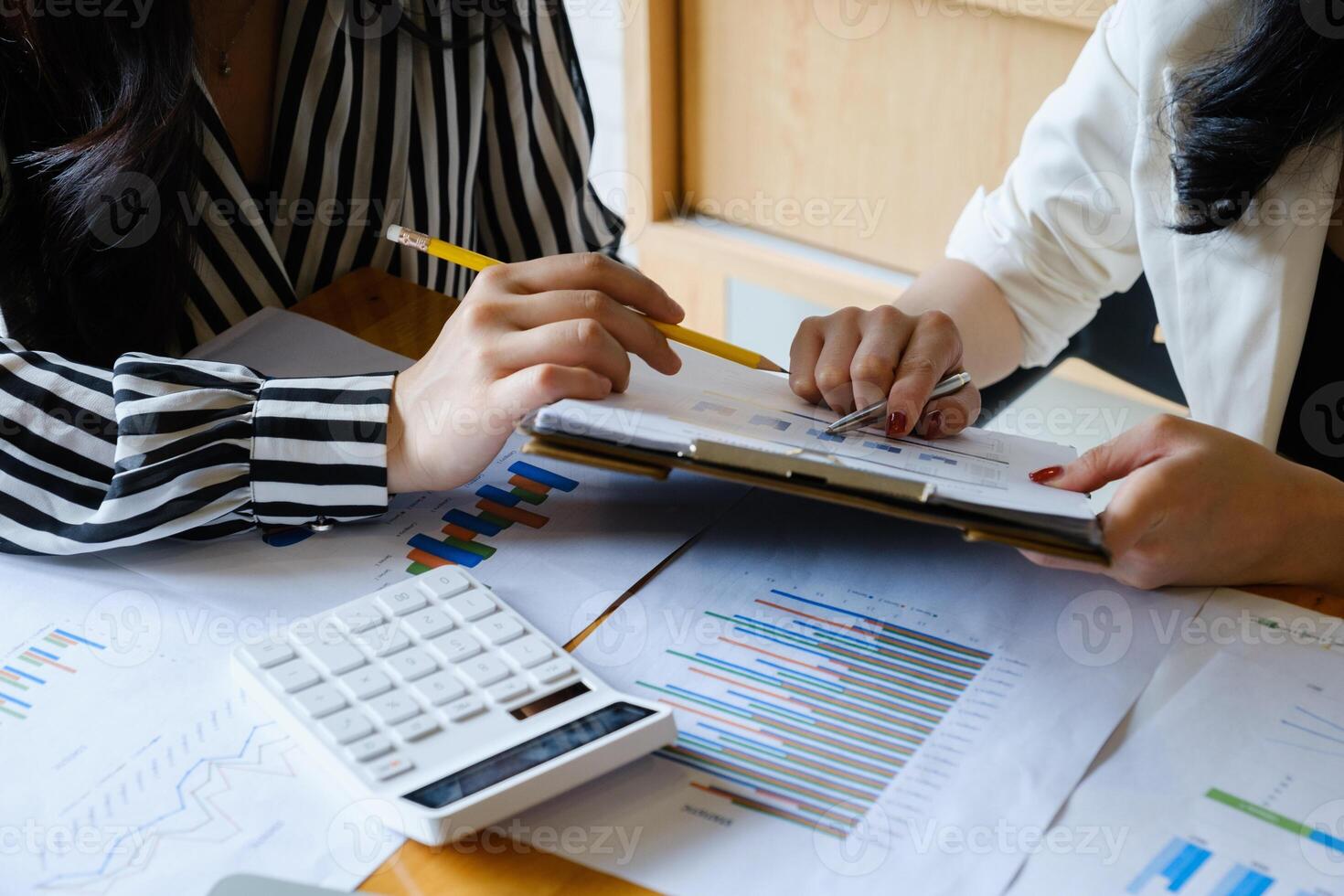 Group of Businesswoman and Accountant checking data document on digital tablet for investigation of corruption account . Anti Bribery concept. photo