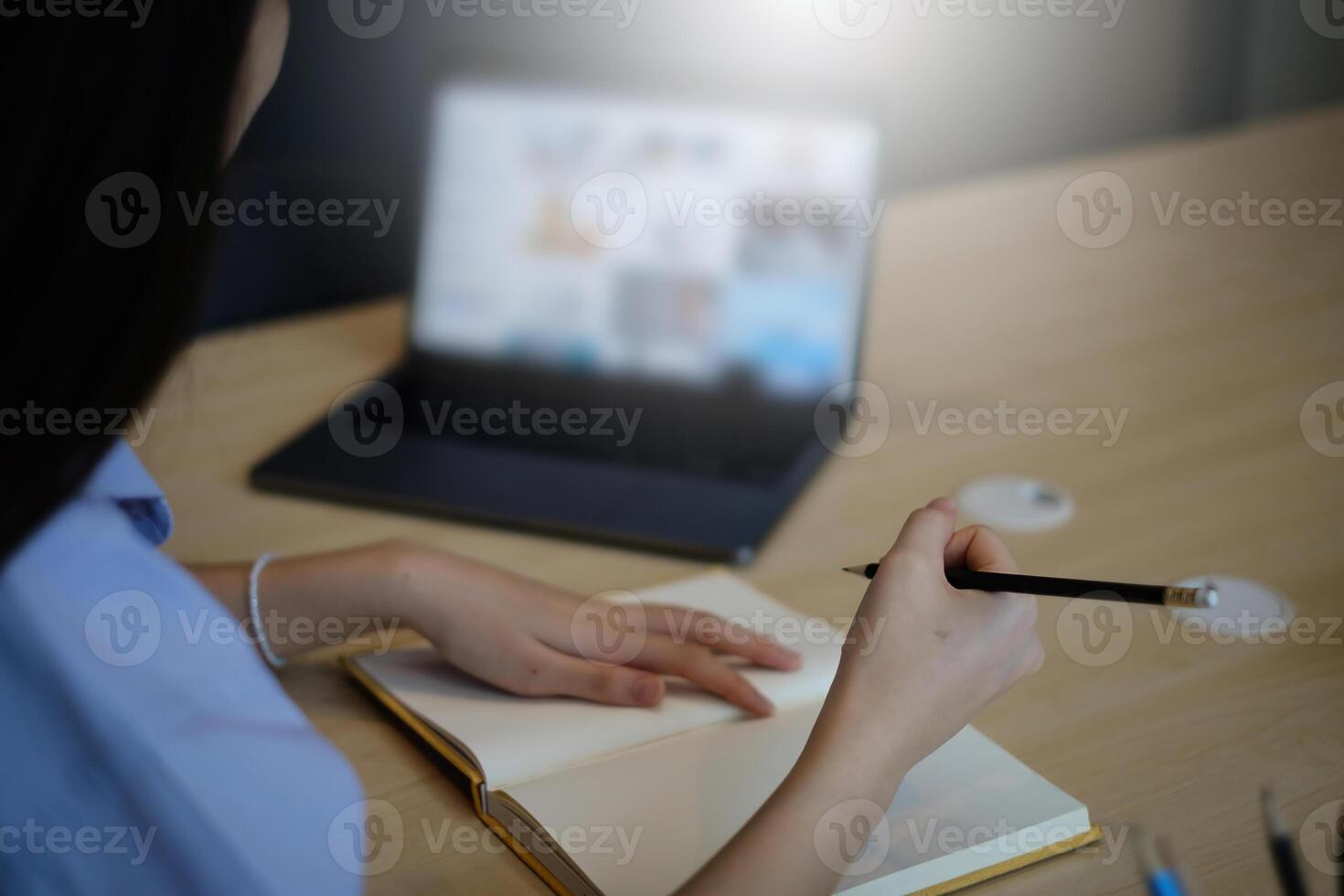 A girl practice basic course exercises by on laptop before online class. Social distancing.stay home. New normal. Covid-19 coronavirus concept. photo