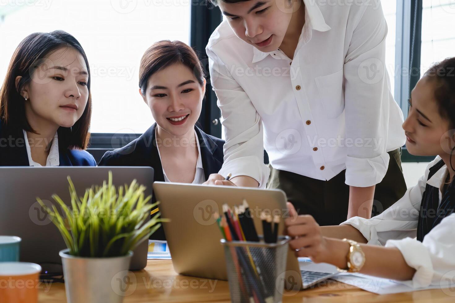 Group of Businesswoman and Accountant checking data document on digital tablet for investigation of corruption account . Anti Bribery concept. photo