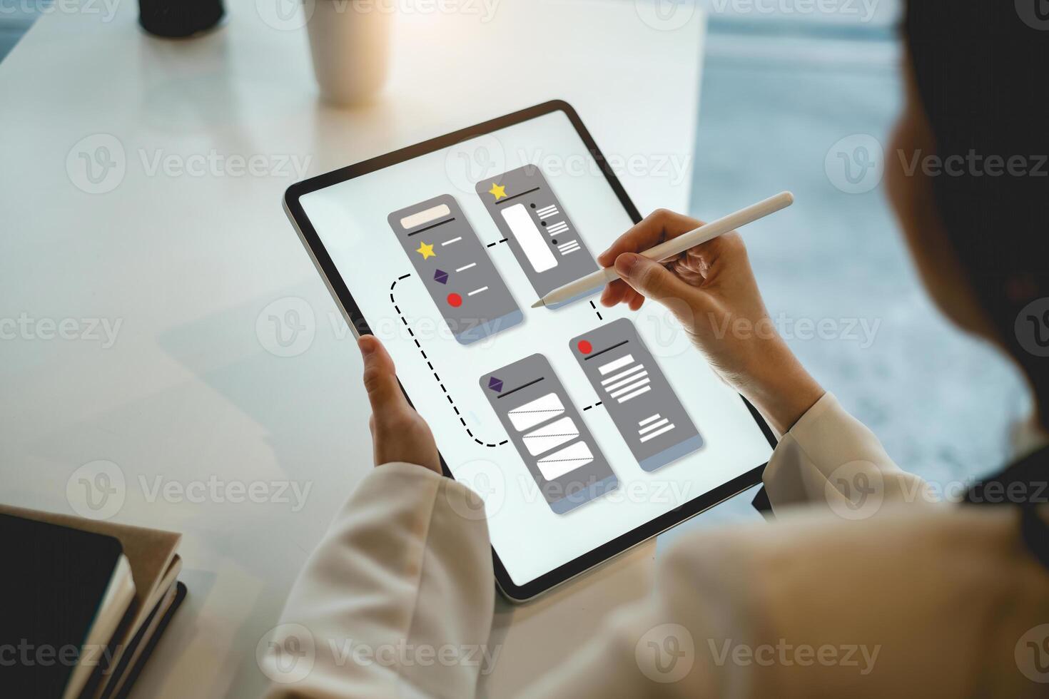 Closeup of female ux developer and ui designer about mobile phone app interface in living room at home. Creative digital development agency concept. photo