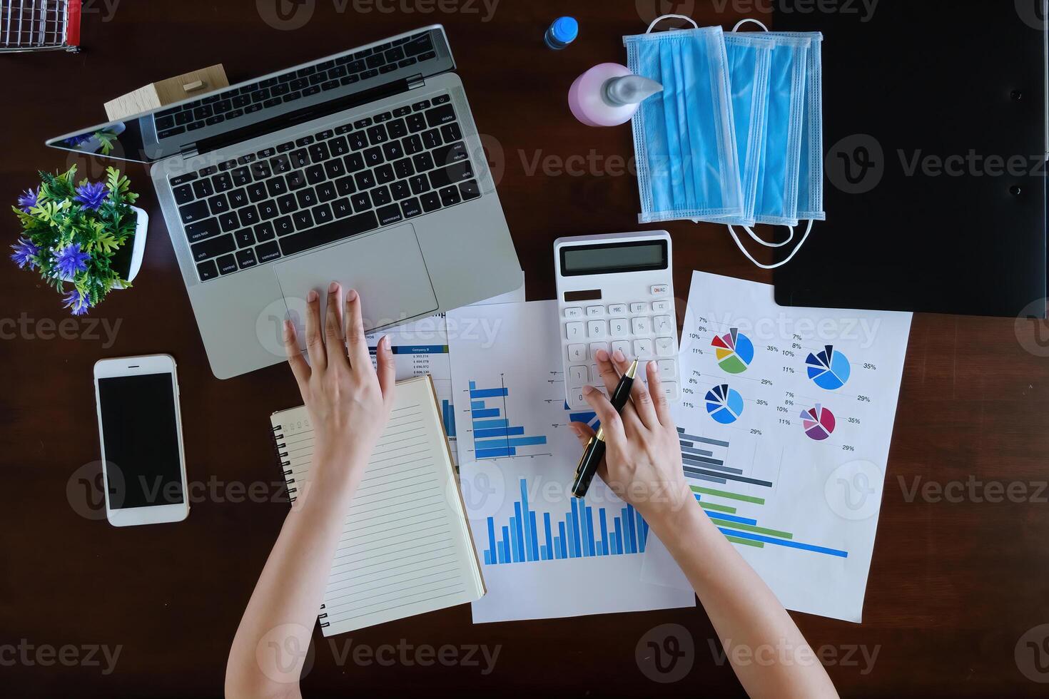 Fund managers researching and analysis Investment stock market by laptop computer. top view. photo