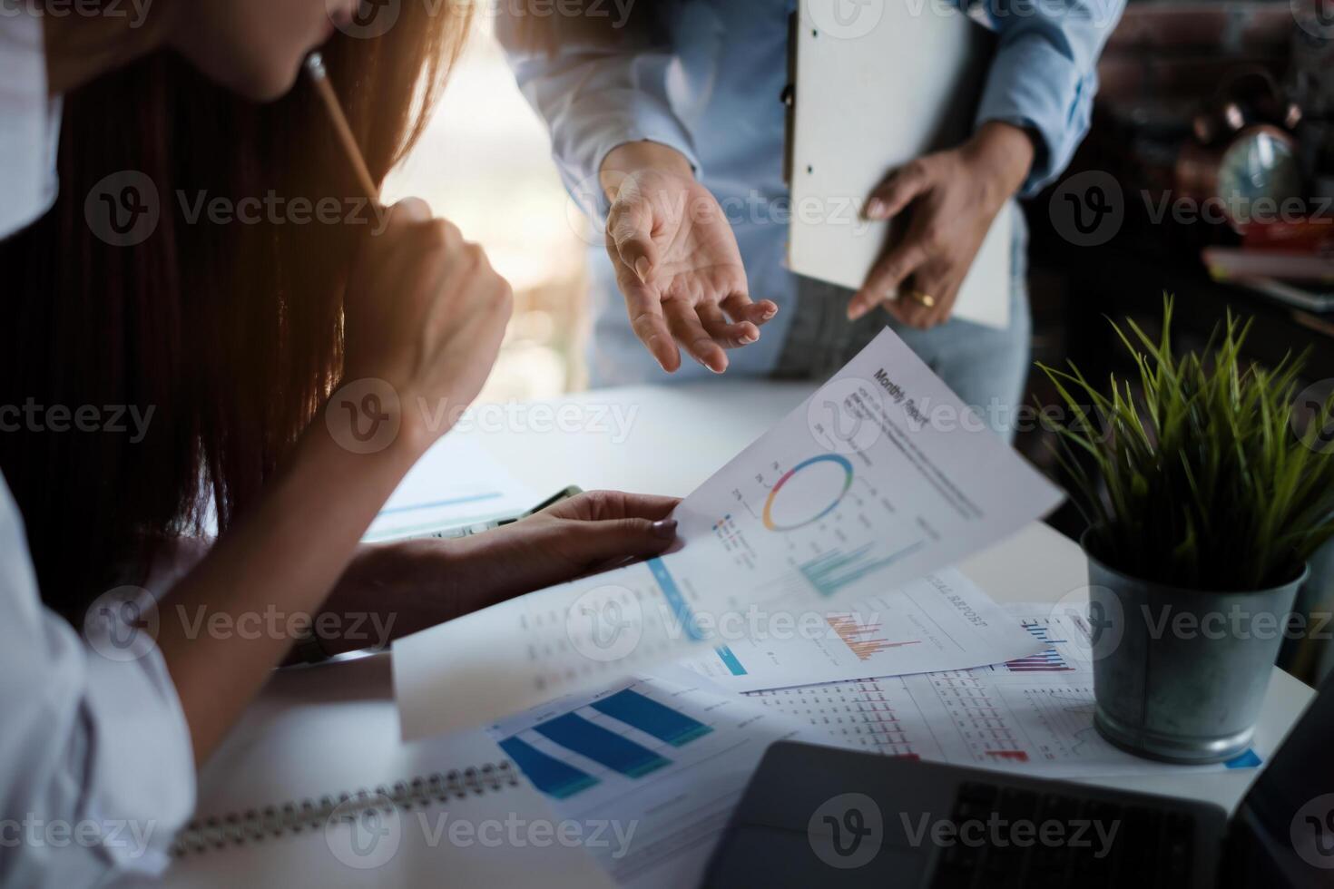 Group of Businesswoman and Accountant checking data document on digital tablet for investigation of corruption account . Anti Bribery concept. photo