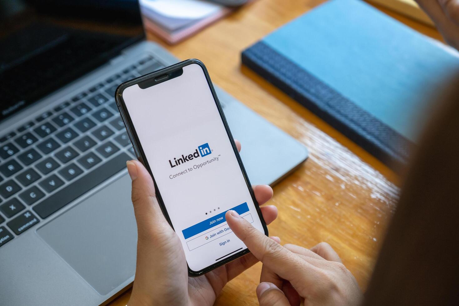 CHIANG MAI, THAILAND. FEB 01, 2021. LinkedIn logo on phone screen. LinkedIn is a social network for search and establishment of business contacts. It is founded in 2002. photo