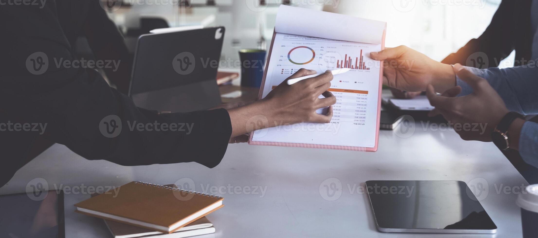 Group of Businesswoman and Accountant checking data document on digital tablet for investigation of corruption account . Anti Bribery concept. photo
