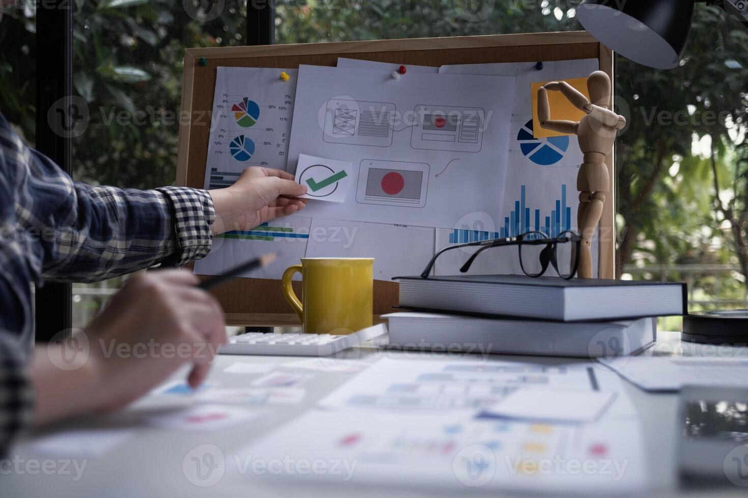 Closeup of female ux developer and ui designer about mobile phone app interface in living room at home.Creative digital development agency concept. photo