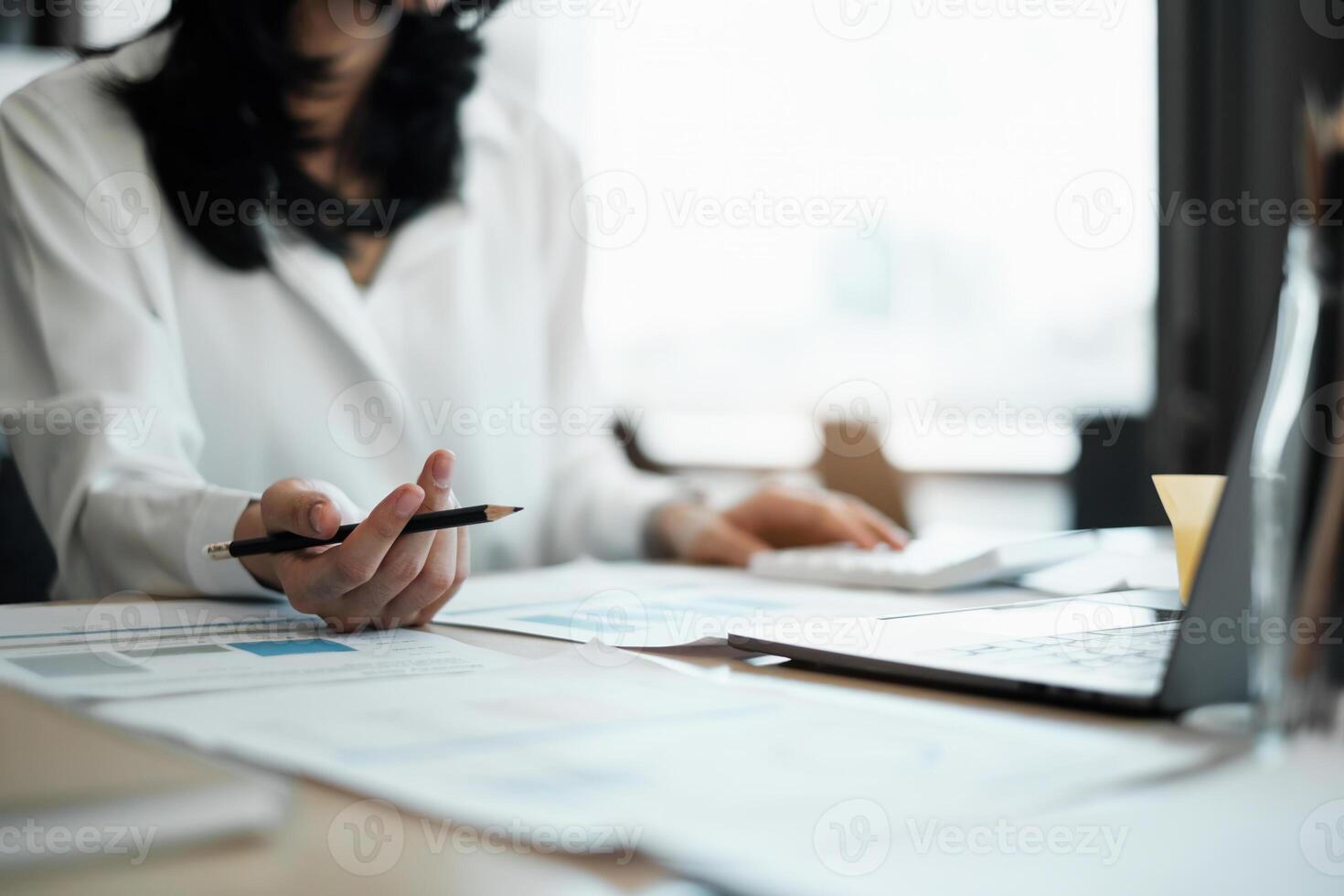 After a long day of hard labor and exhaustion in the office, female businesswoman boss accountant relaxes. photo