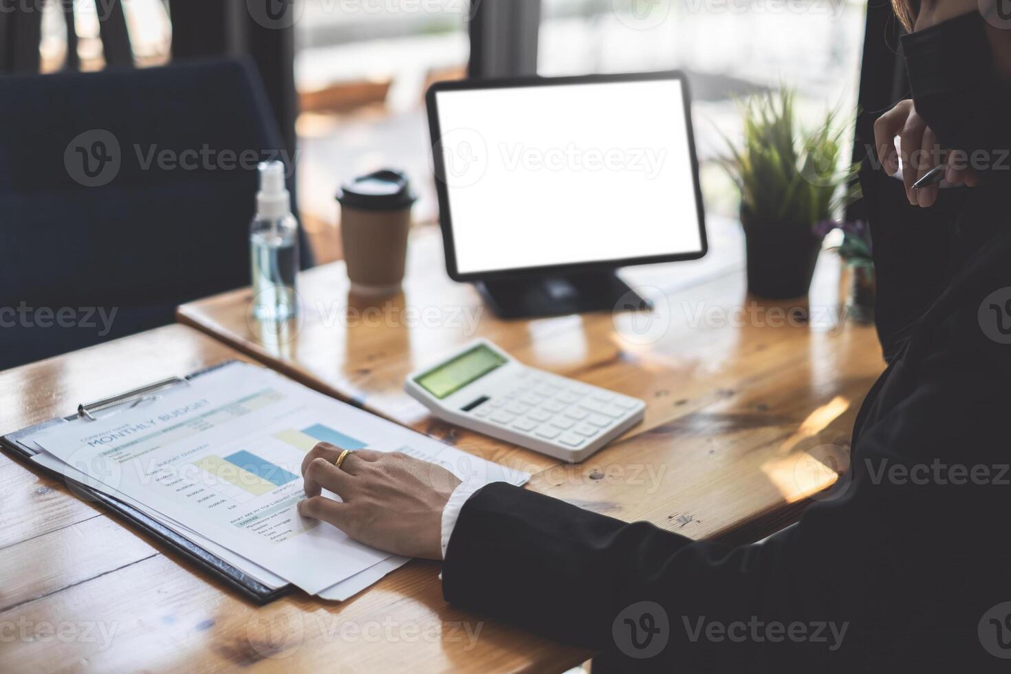 Administrator accountant making report calculating balance. Audit and Anti Bribery concept. photo