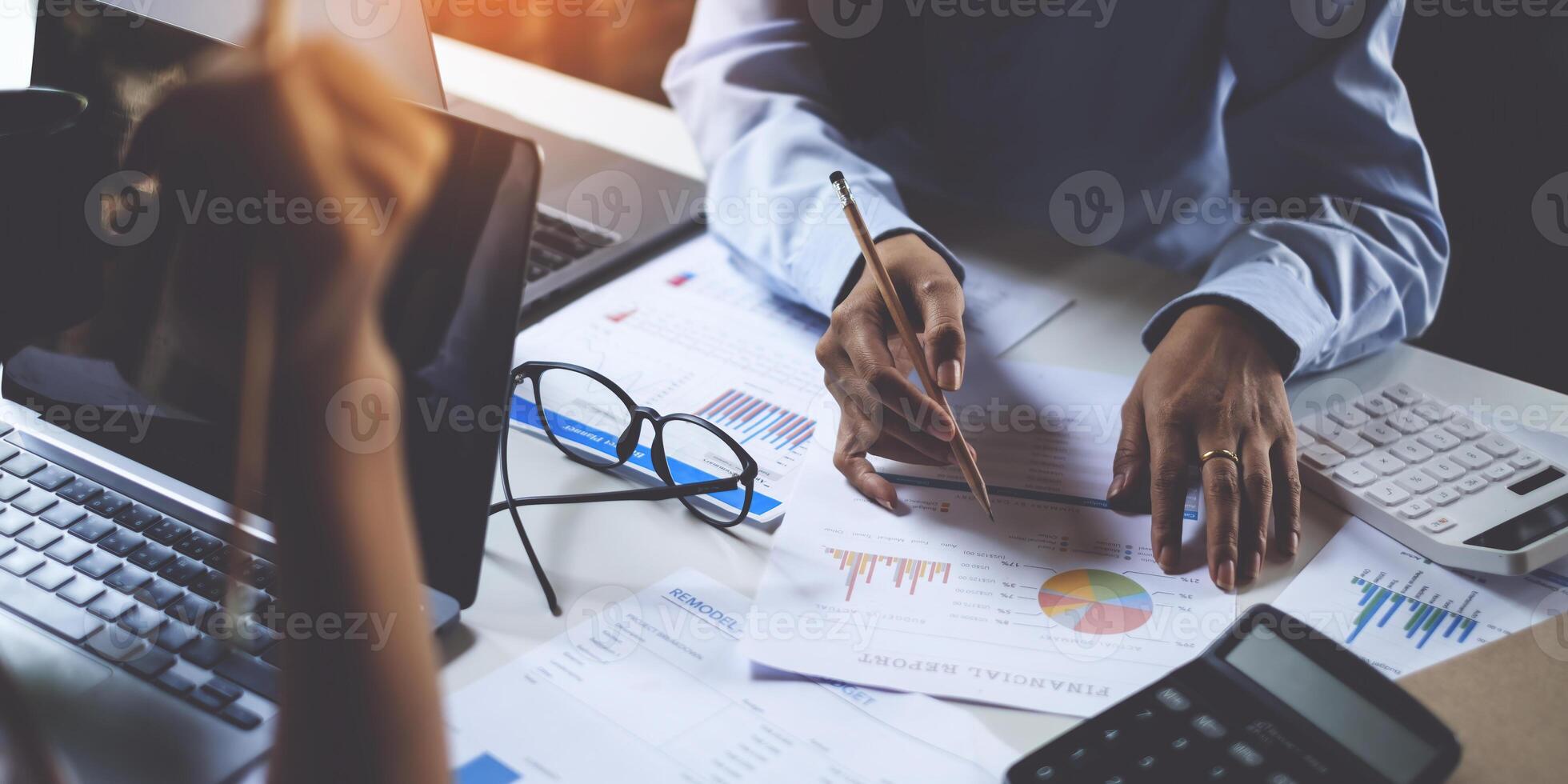 Businesswoman and Accountant checking data document for investigation of corruption account . Anti Bribery concept. photo