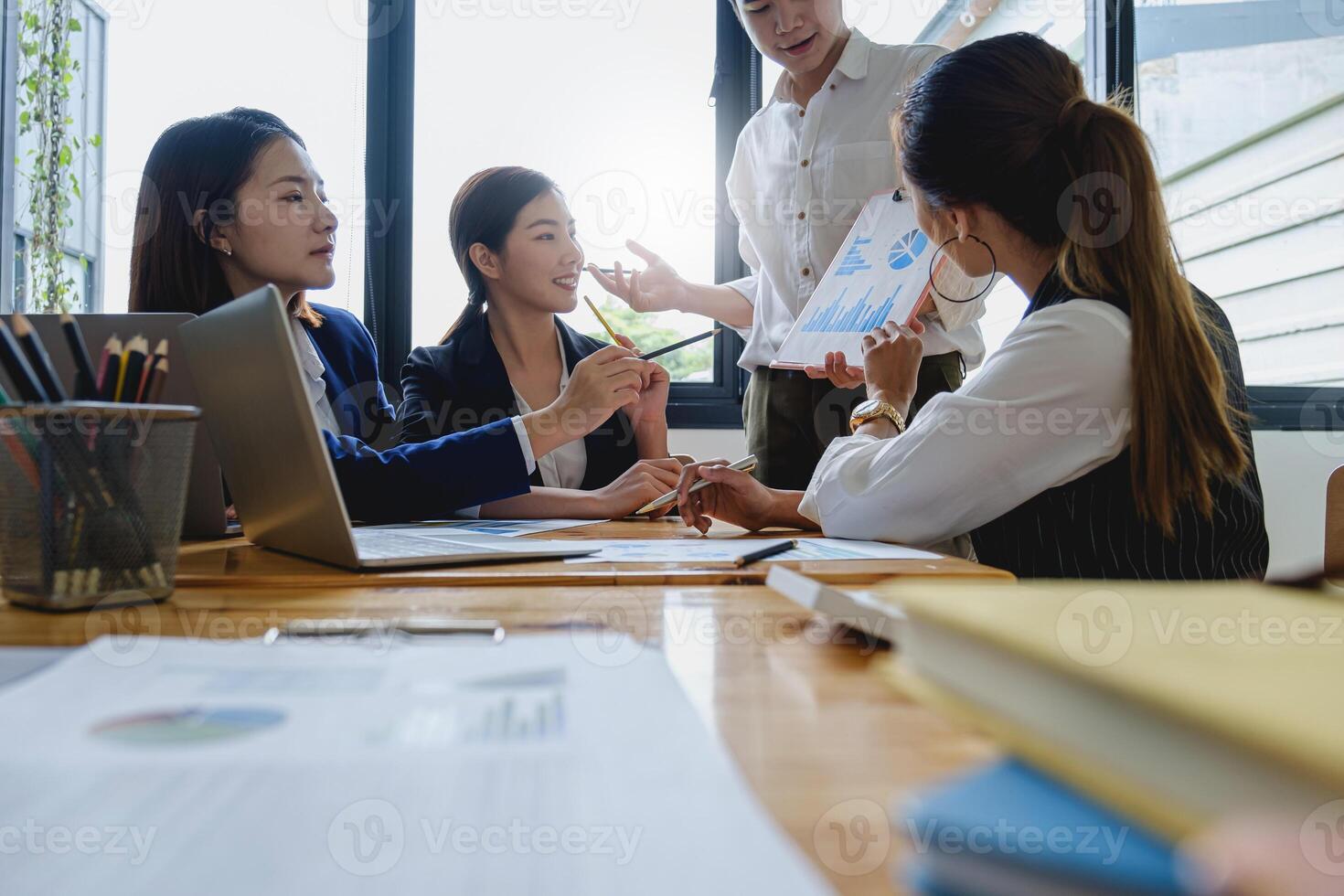 Group of Businessman and Accountant checking data document on digital tablet for investigation of corruption account . Anti Bribery concept. photo