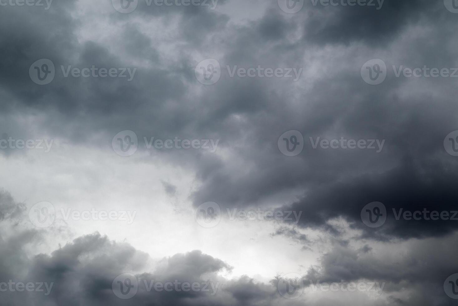 Dark grey storm clouds background photo