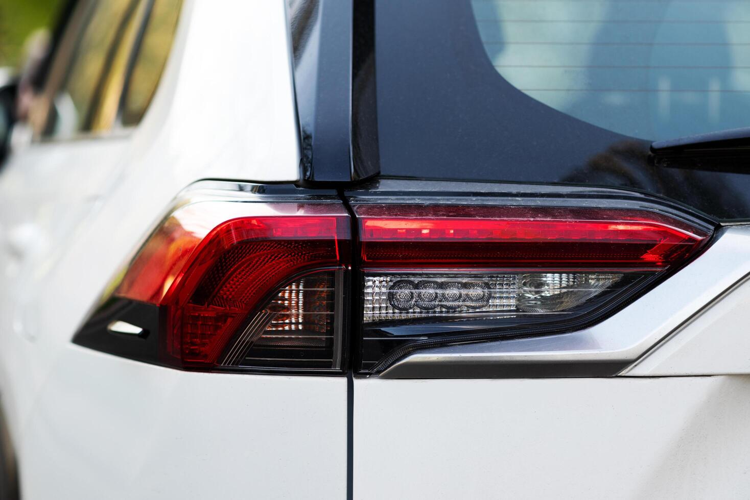 Ukraine, Kyiv, April 10, 2024. Toyota RAV4 Hybrid, new model, rear brake light close up. photo