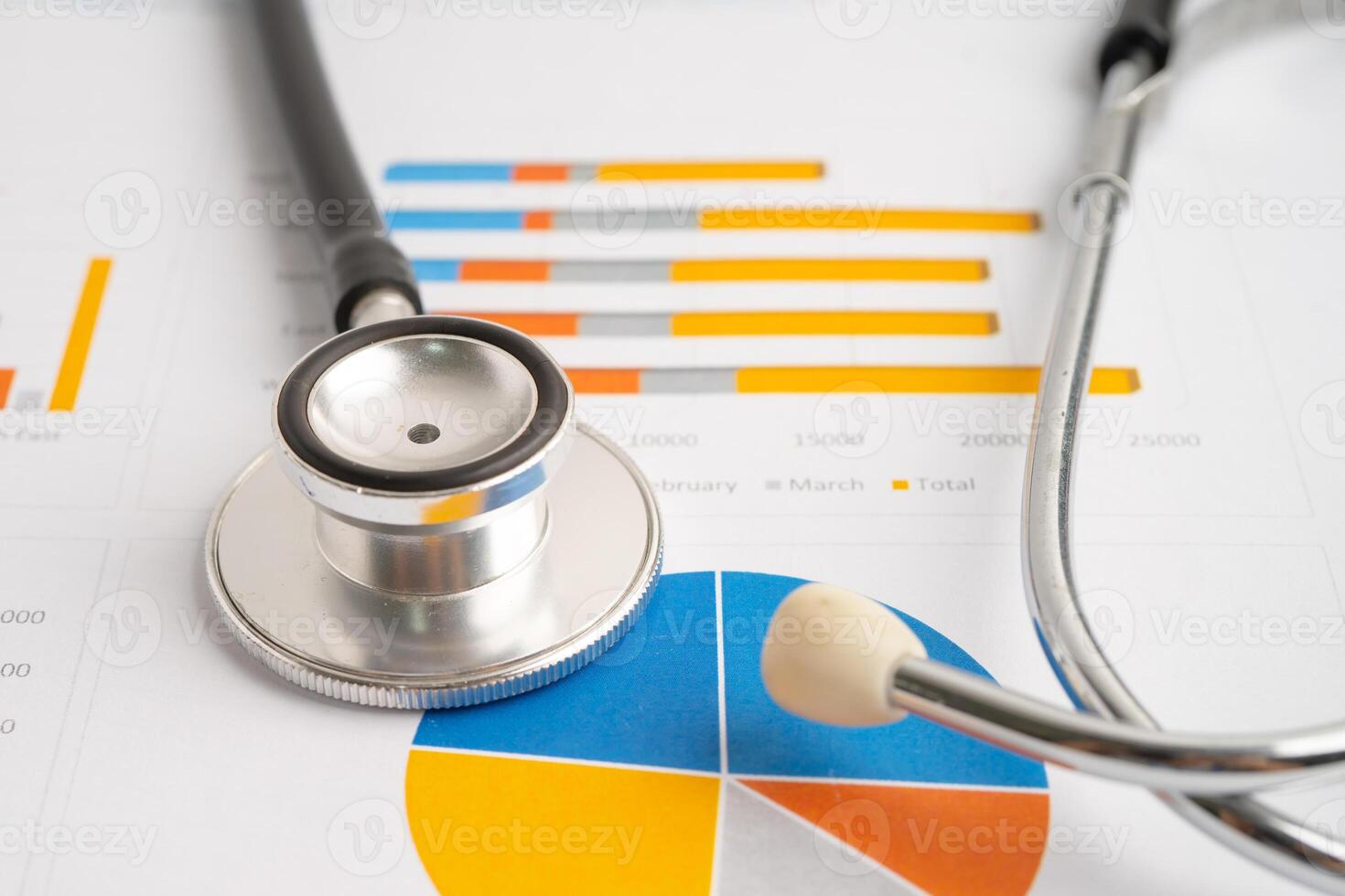 Stethoscope on spreadsheet and graph paper, Finance, Account, Statistics, Investment, Analytic research data economy and Business company concept. photo