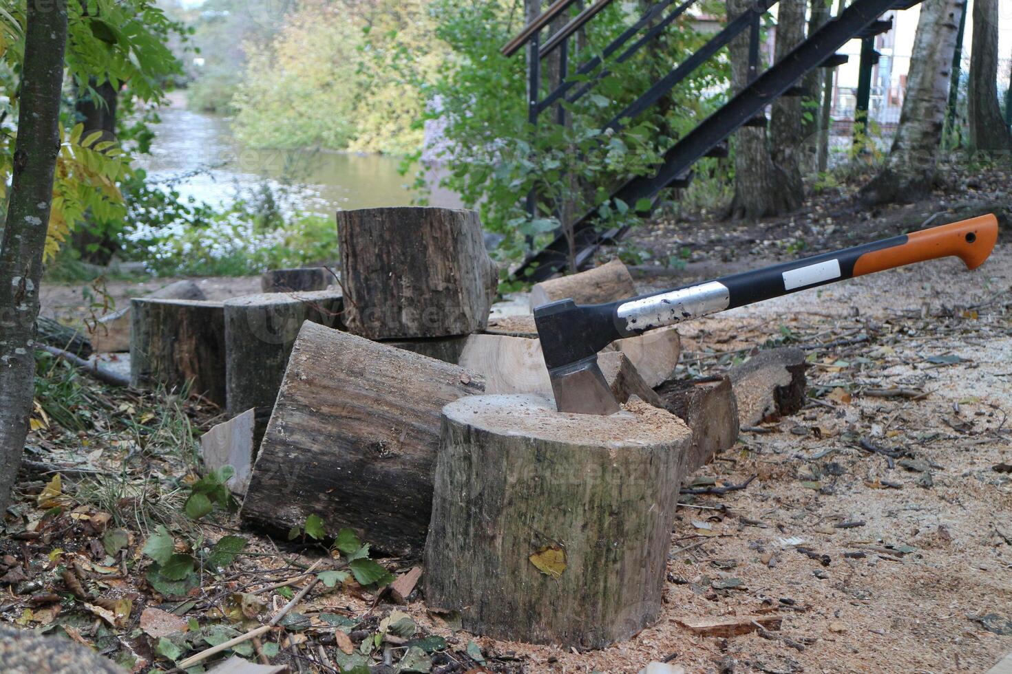 a pile of firewood chopped with an ax ax cleaver in a log photo