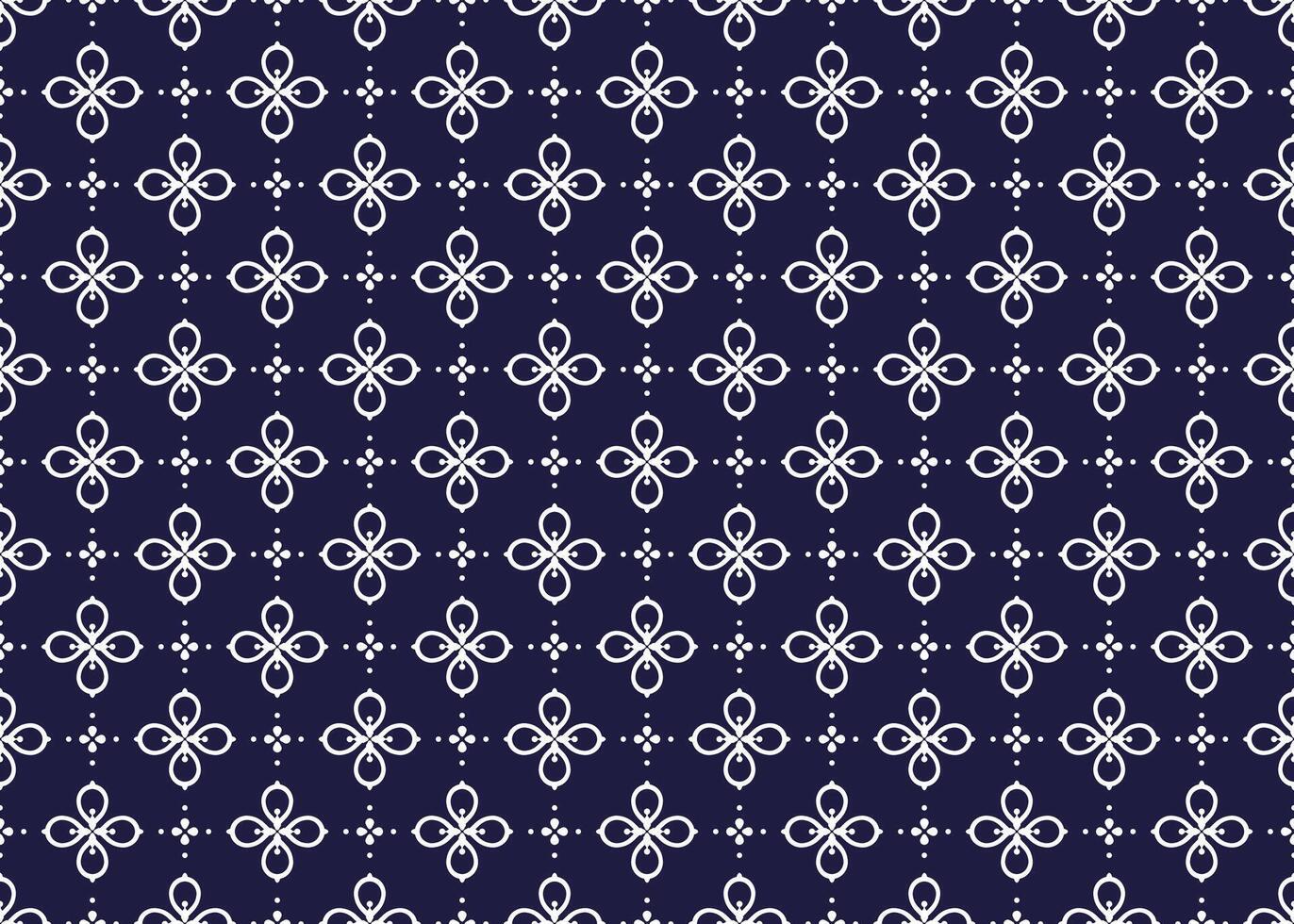 White symbol flowers on dark blue background, ethnic fabric seamless pattern design for cloth, carpet, batik, wallpaper, wrapping etc. vector
