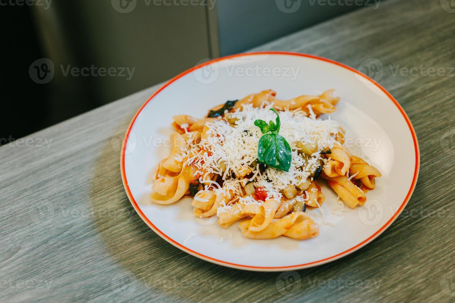 A plate of traditional Italian dish pasta for lunch in a cafe. photo