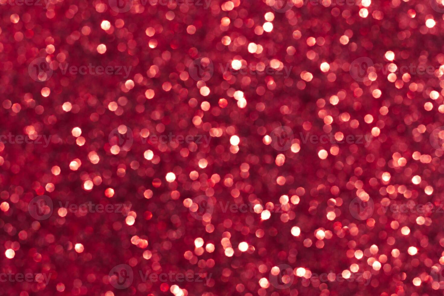 Abstract red background. Shiny glitter bokeh in red colors. photo