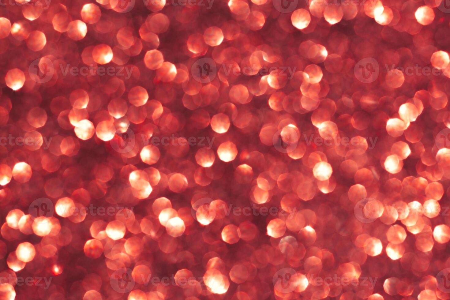 Abstract red background. Shiny glitter bokeh in red colors. photo