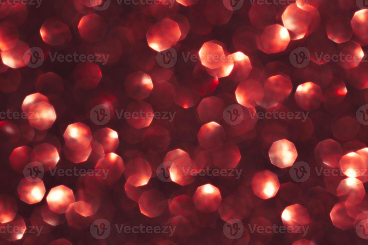Abstract red background. Shiny glitter bokeh in red colors. photo