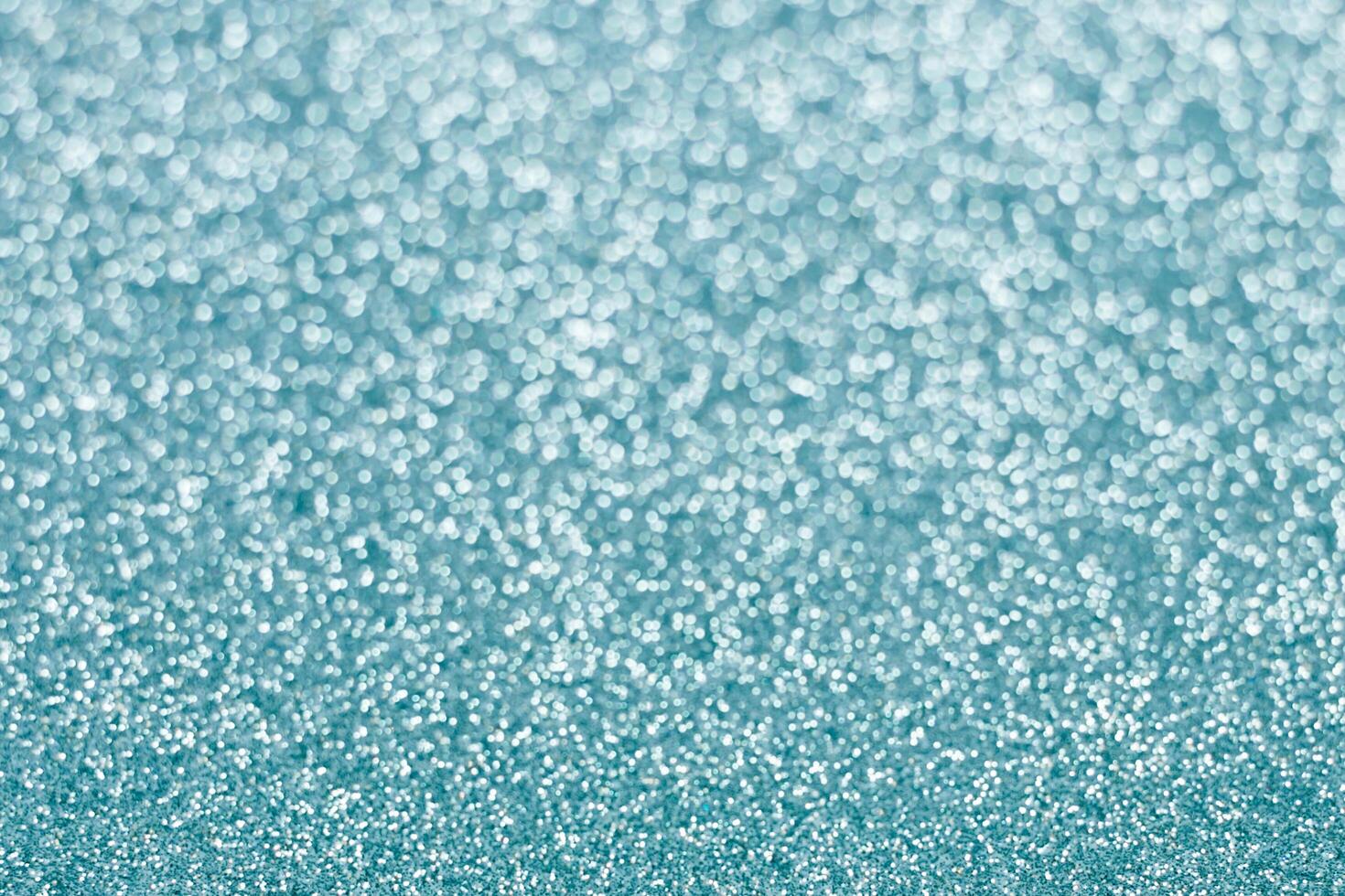 Abstract blue glitter background. Sparkle blue bokeh christmas background. photo