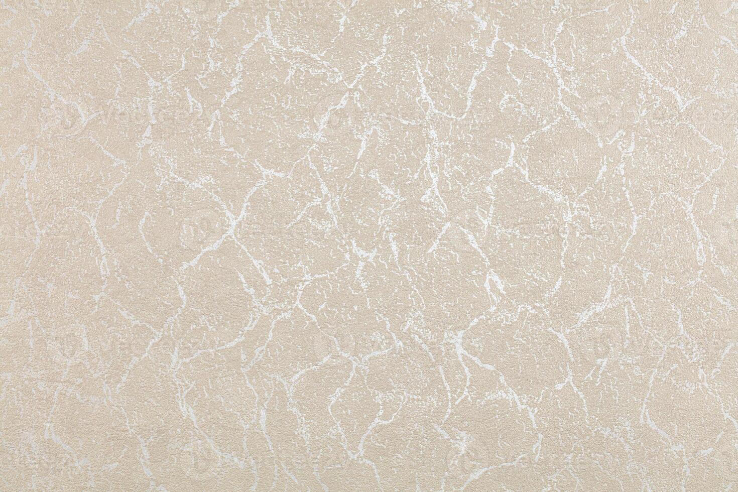 Background of beige evenly textured paper wallpaper with chaotic spots and lines. photo