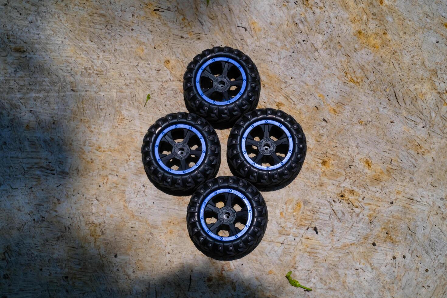 A set of toy car tires. Four pieces of RC Remote Control Car tires. Toys Photography. Hobbies and leisure. Selective Focus. Textured Details. Shot in Macro lens photo