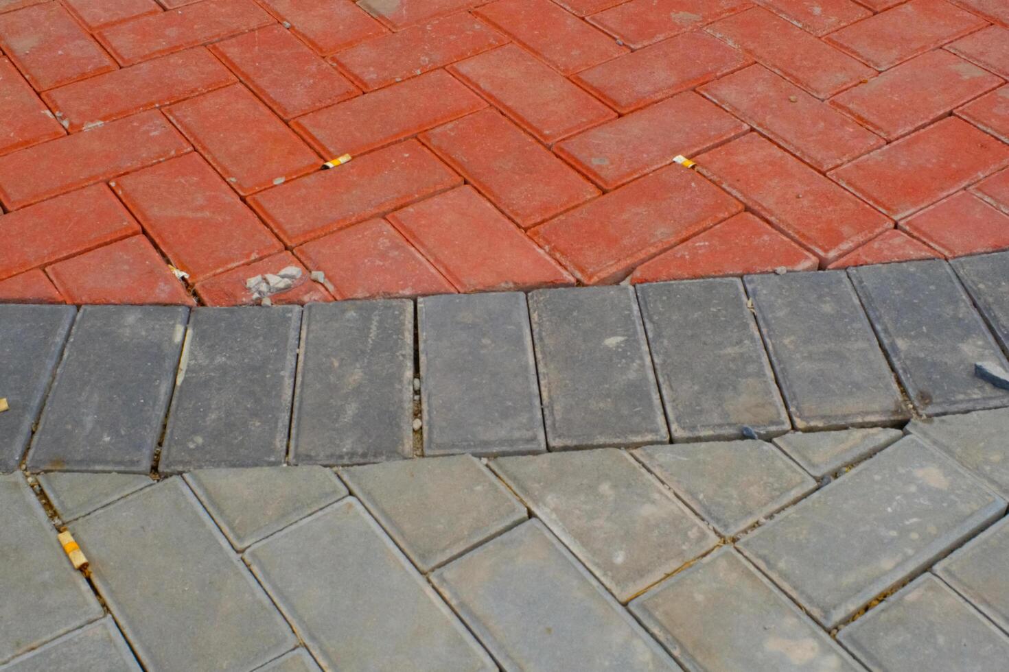 Background Photography. Textured Backgrounds. Detail of road texture with paving blocks. Square paving blocks painted in gray and red. Bandung, Indonesia photo