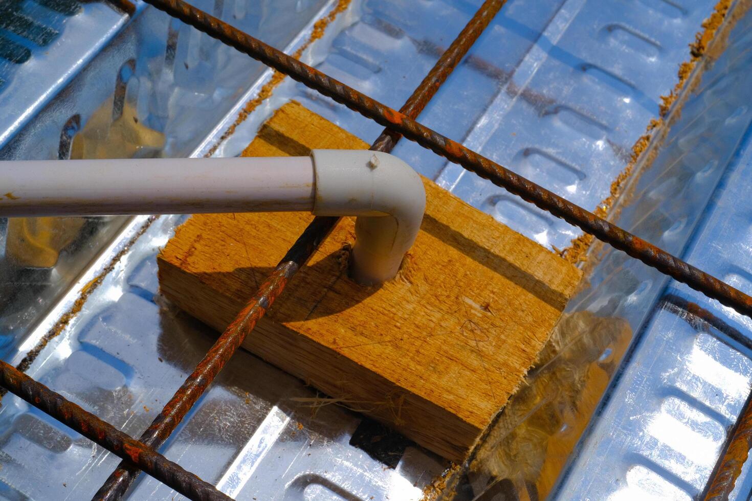 Industrial Photography. Construction Works. Installation of pipes inside wiremesh. Pipes are installed before floor casting. Bandung, Indonesia photo