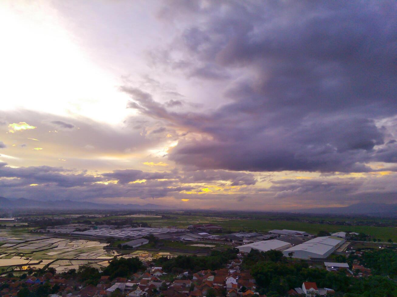 Sunset View. Aerial Photography. Picturesque Panoramic Aerial sky in the afternoon. Shot from a drone flying 200 meters high. Cikancung, Indonesia photo