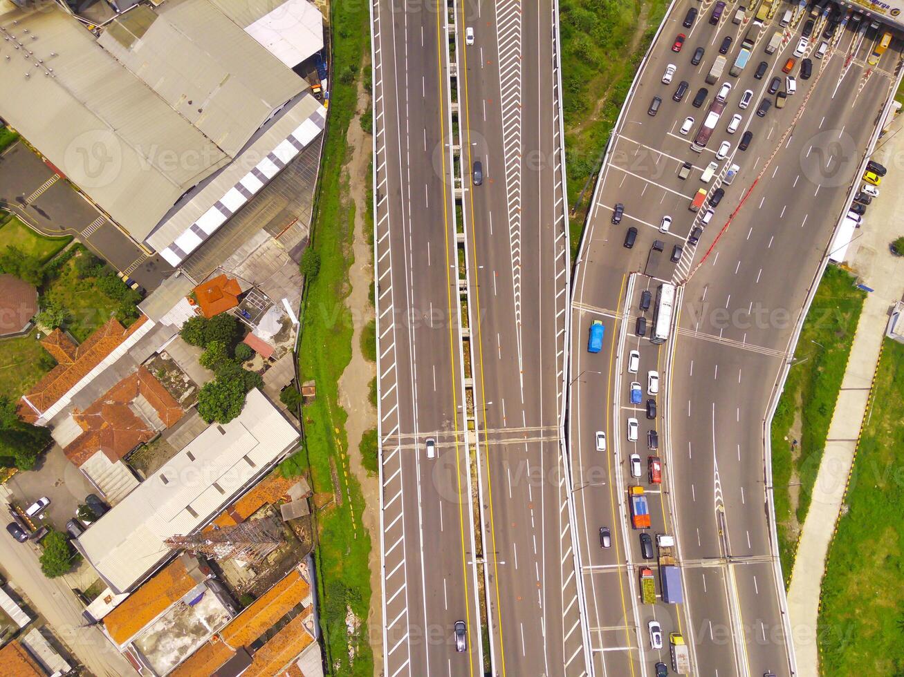 Bird eye view of Vehicle queue at the Purbaleunyi toll gate, due to the surge in travelers during the holiday season, Bandung, West Java Indonesia, Asia. Transportation Industry. Top view. Aerial Shot photo