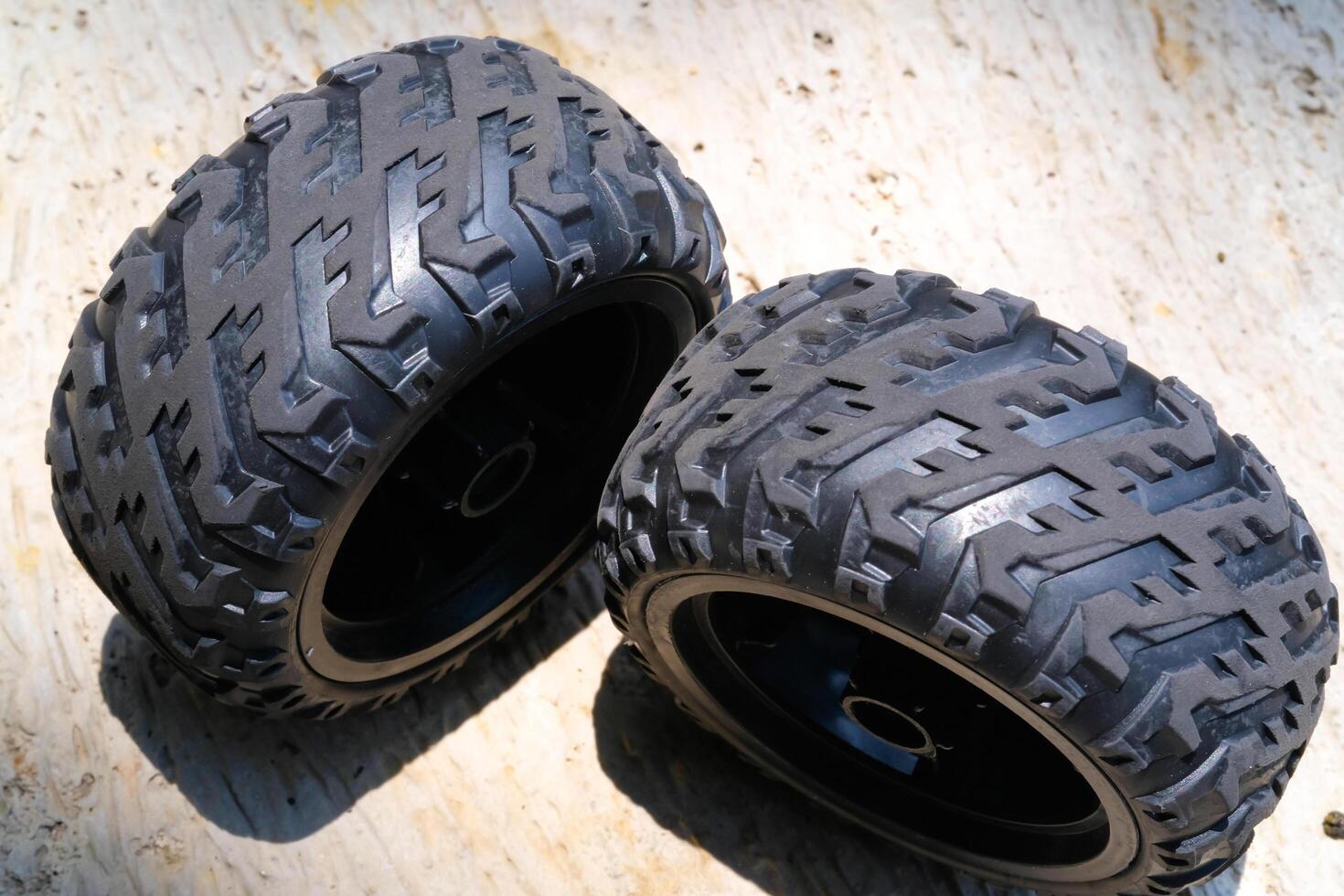 A pair of new Toy car rubber tires. Part of RC Remote Control Car. Toys Photography. Hobbies and leisure. Selective Focus. Textured Details. Shot in Macro lens photo