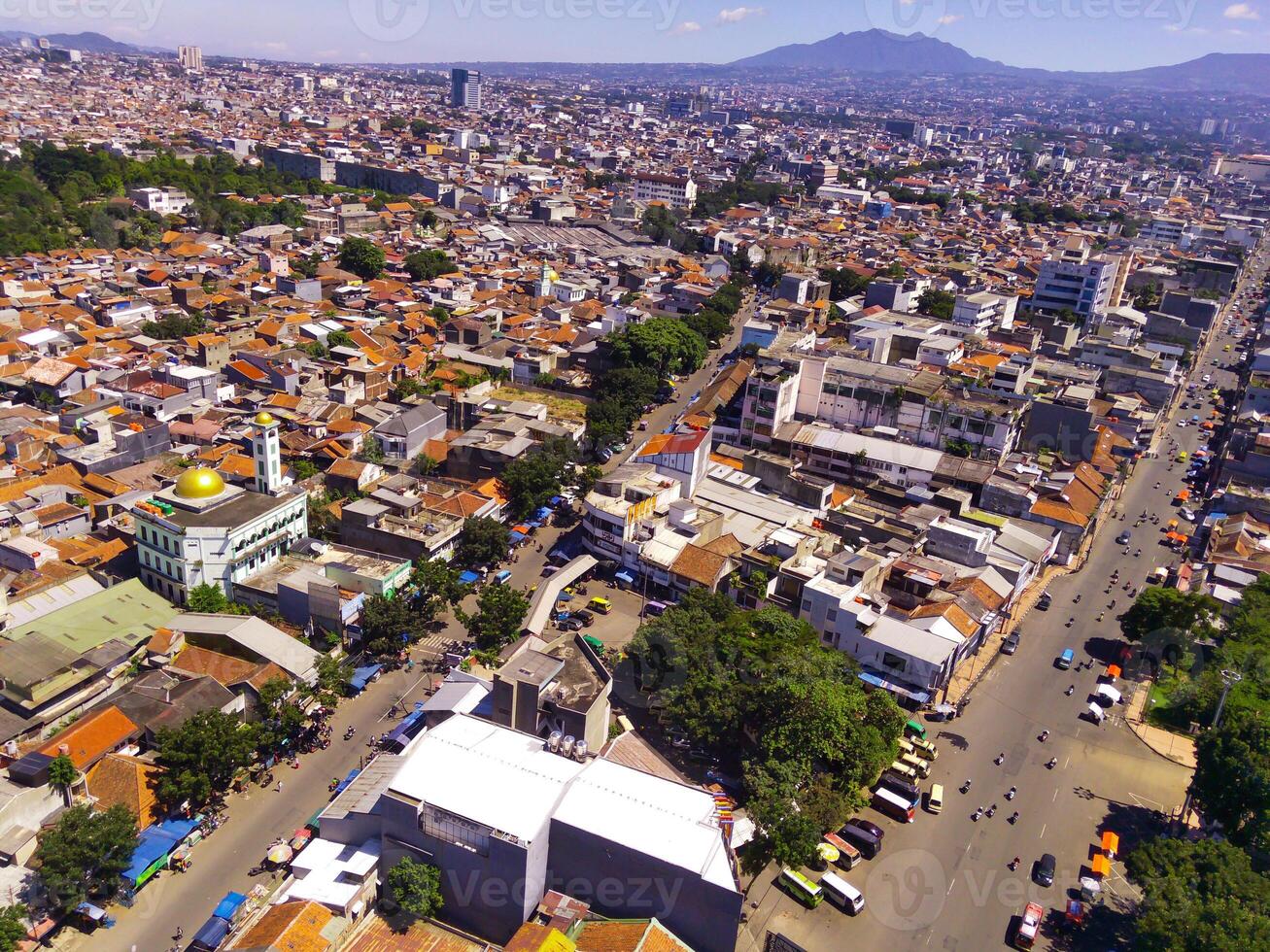 Cityscape of an overpopulated residential district in Bandung city. View of the dense residential landscape in Downton. Aerial photography. Social Issues. Shot from a flying drone photo