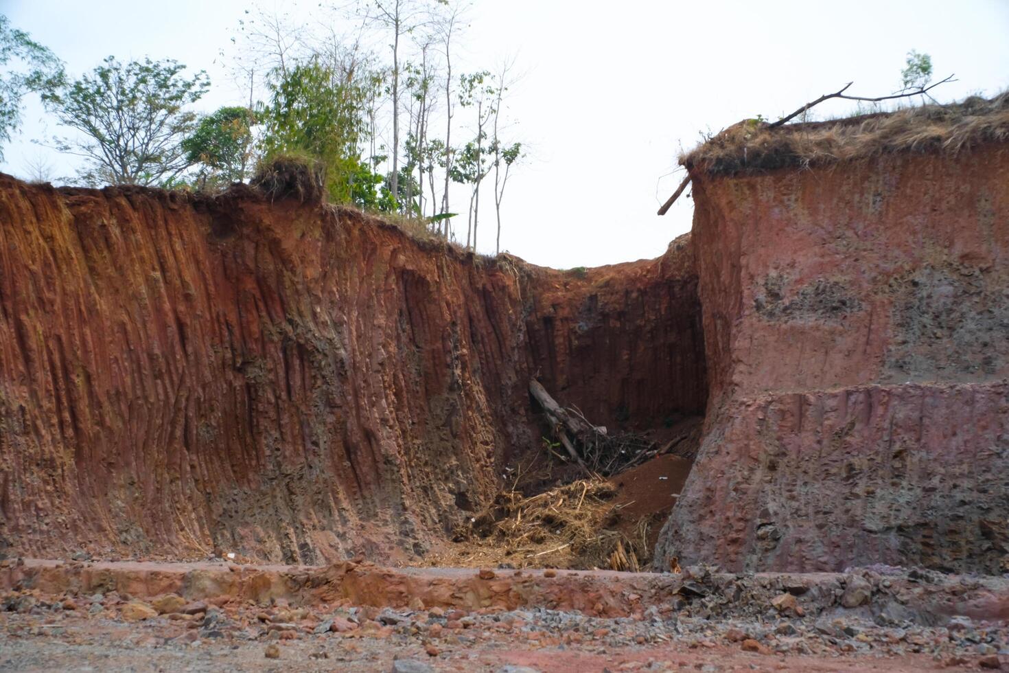 Industrial Photography Landscapes. Aerial view of Dredged hills, reclamation land area prepare for housing construction in rural area. Aerial Shot from a flying drone. Bandung - Indonesia photo