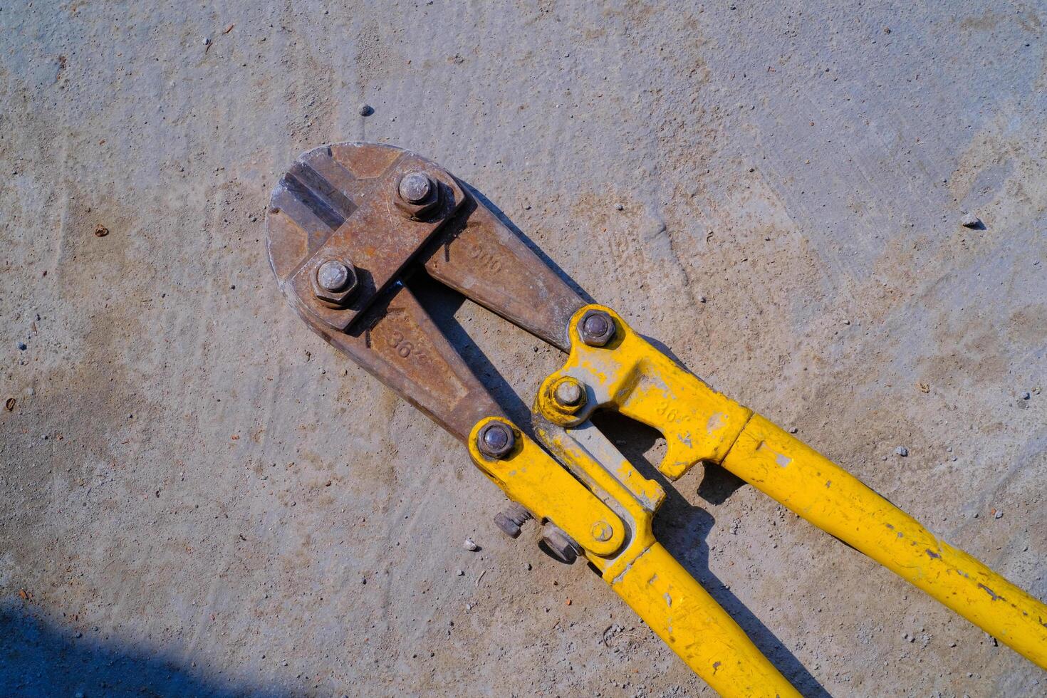 Industrial Photography. Construction Tools. Isolated Iron bar cutting scissors. A bar iron cutting tool owned by a builder. Bandung, Indonesia photo