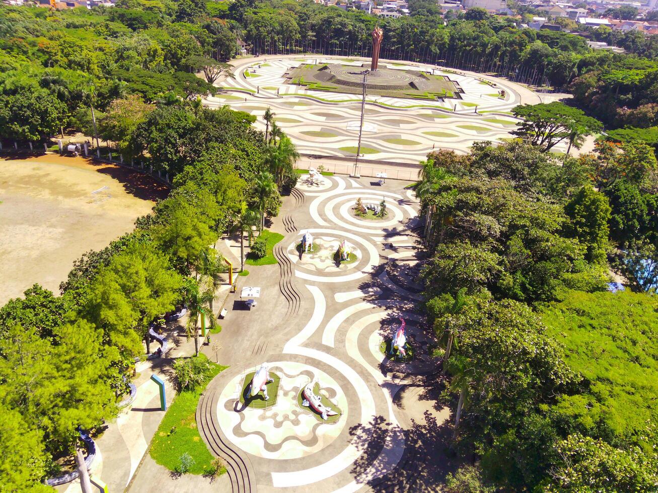 Aerial shot of city park with beautiful floor patterns and trees. Textured Background floor pattern. Aerial photography. Textured details. Shot from a flying drone photo