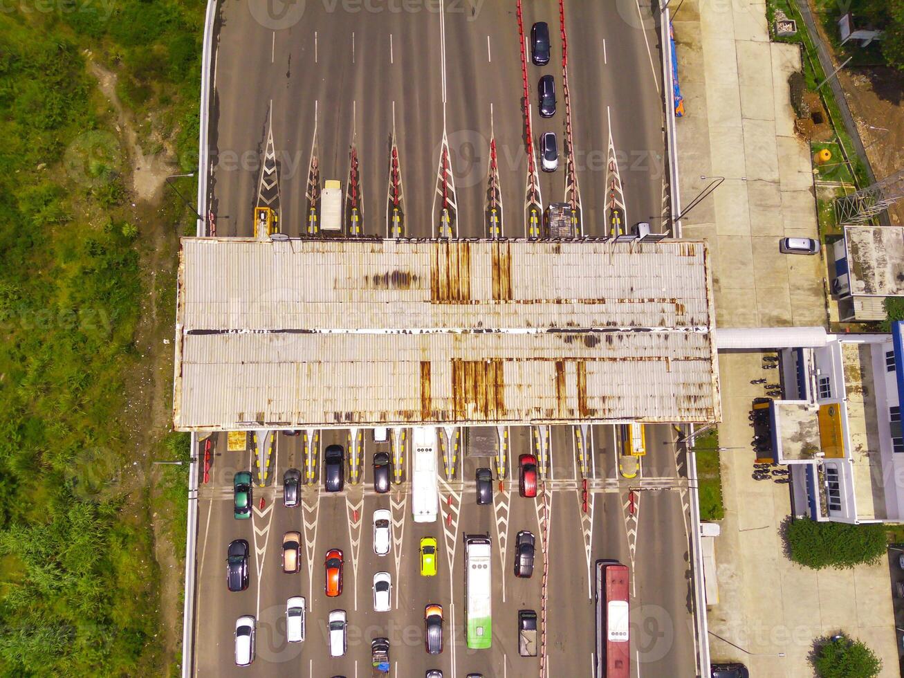 Bird eye view of Vehicle queue at the Purbaleunyi toll gate, due to the surge in travelers during the holiday season, Bandung, West Java Indonesia, Asia. Transportation Industry. Top view. Aerial Shot photo