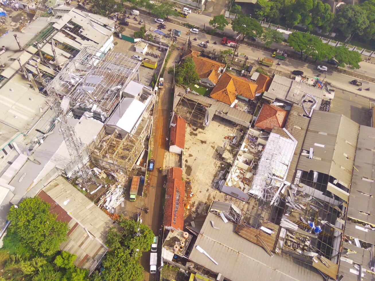 Damage to roofs and buildings in the Dwipapuri and Kahatex industrial areas due to tornadoes at Rancakek and the Sumedang border on 21 February 2024, Indonesia. Scattered debris causes traffic jams photo