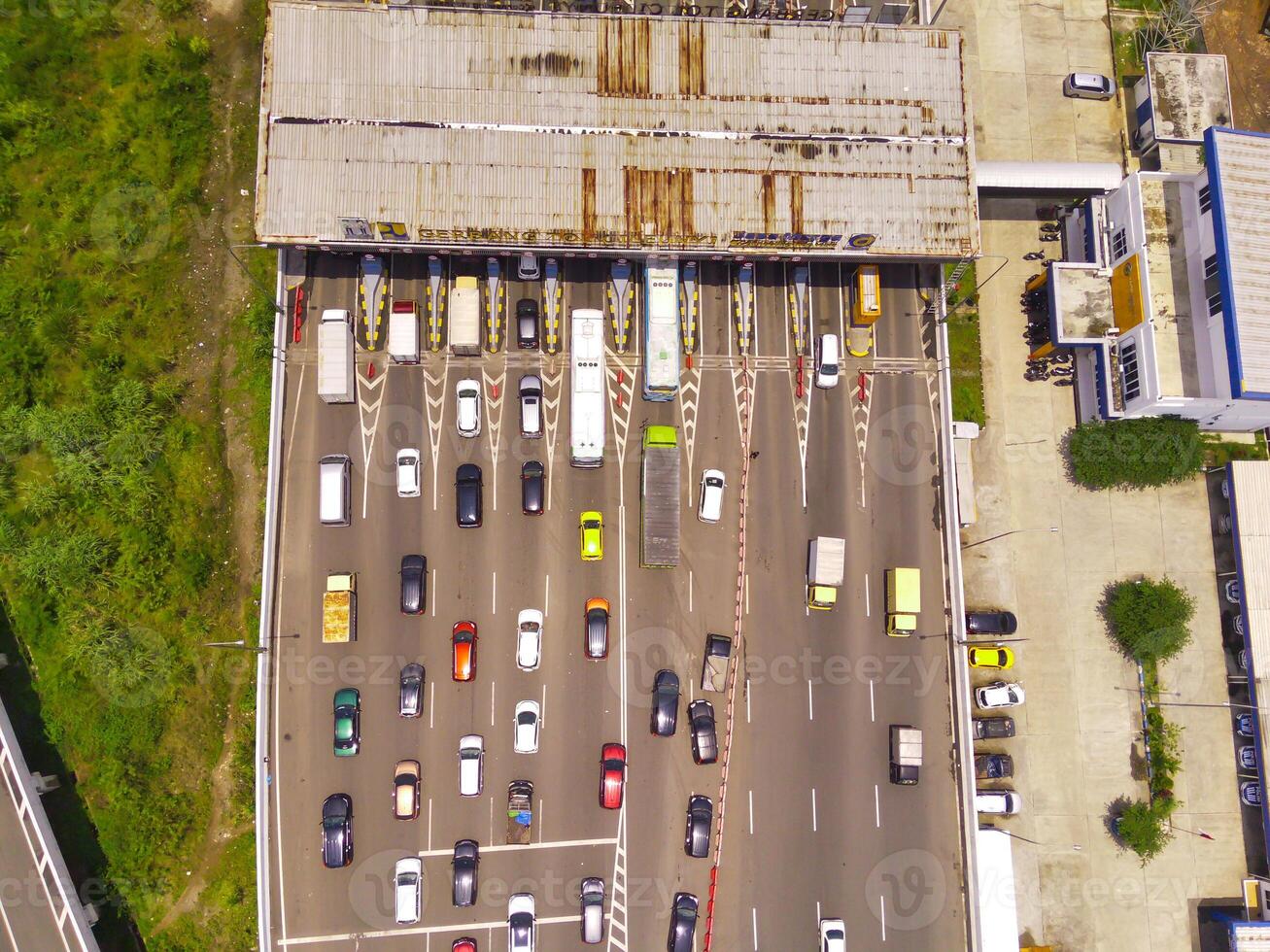 Bird eye view of Vehicle queue at the Purbaleunyi toll gate, due to the surge in travelers during the holiday season, Bandung, West Java Indonesia, Asia. Transportation Industry. Top view. Aerial Shot photo