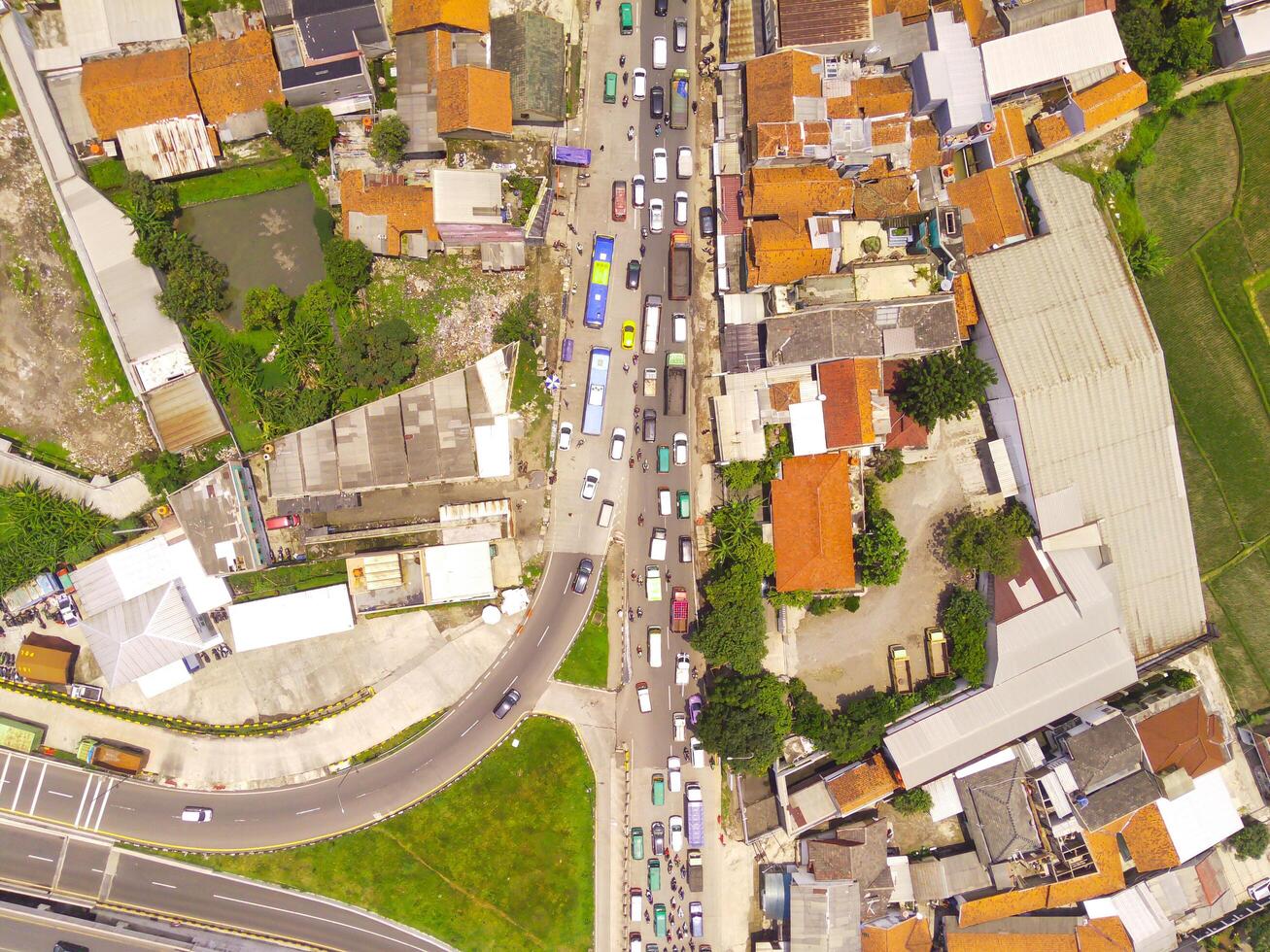 Congestion due to Eid homecoming traffic. Top view of traffic jam at road junction, Bandung - Indonesia. Transportation Industry. Above. Inter-city road access. Shot from a drone. photo