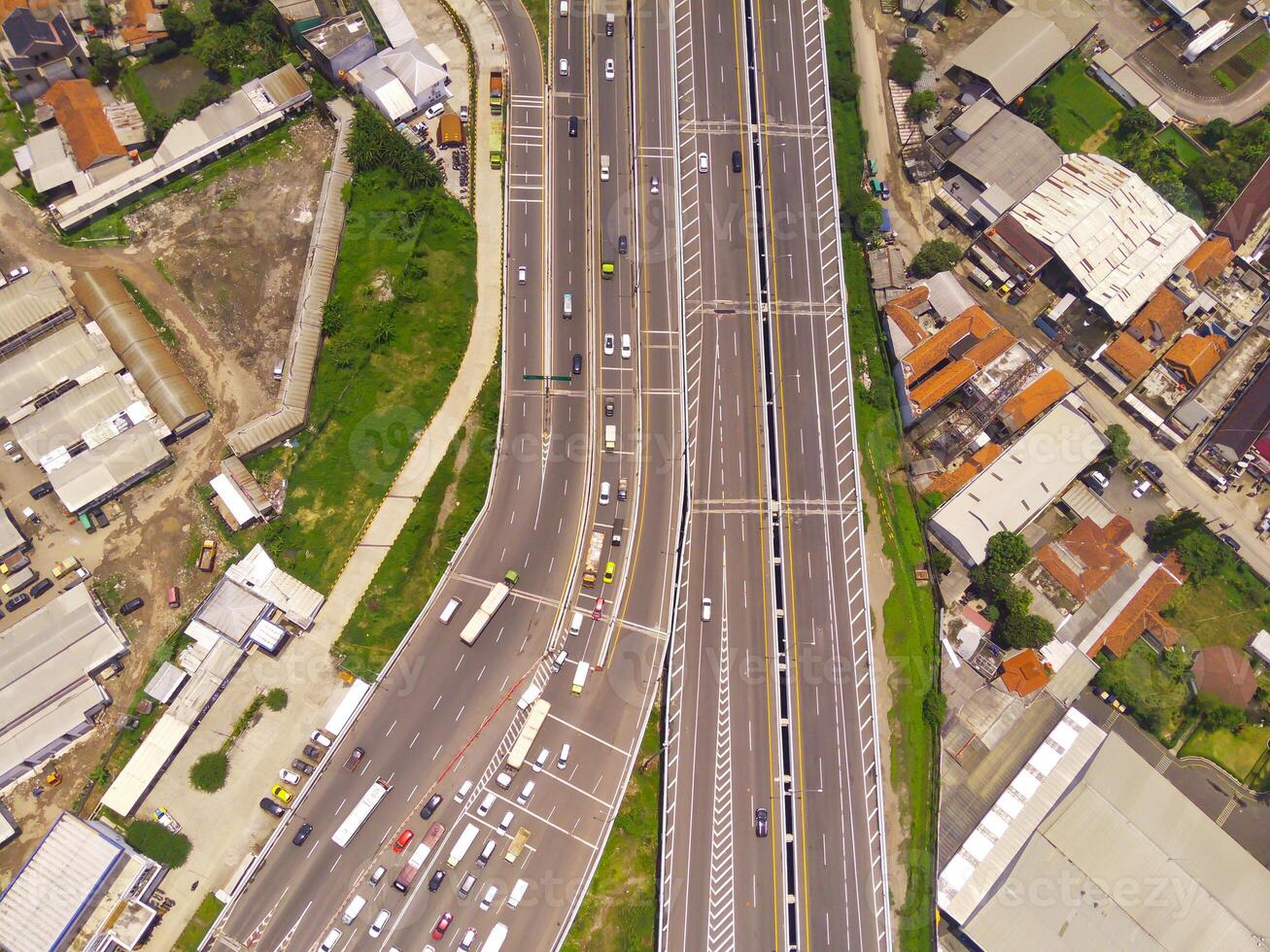 Bird eye view of Vehicle queue at the Purbaleunyi toll gate, due to the surge in travelers during the holiday season, Bandung, West Java Indonesia, Asia. Transportation Industry. Top view. Aerial Shot photo