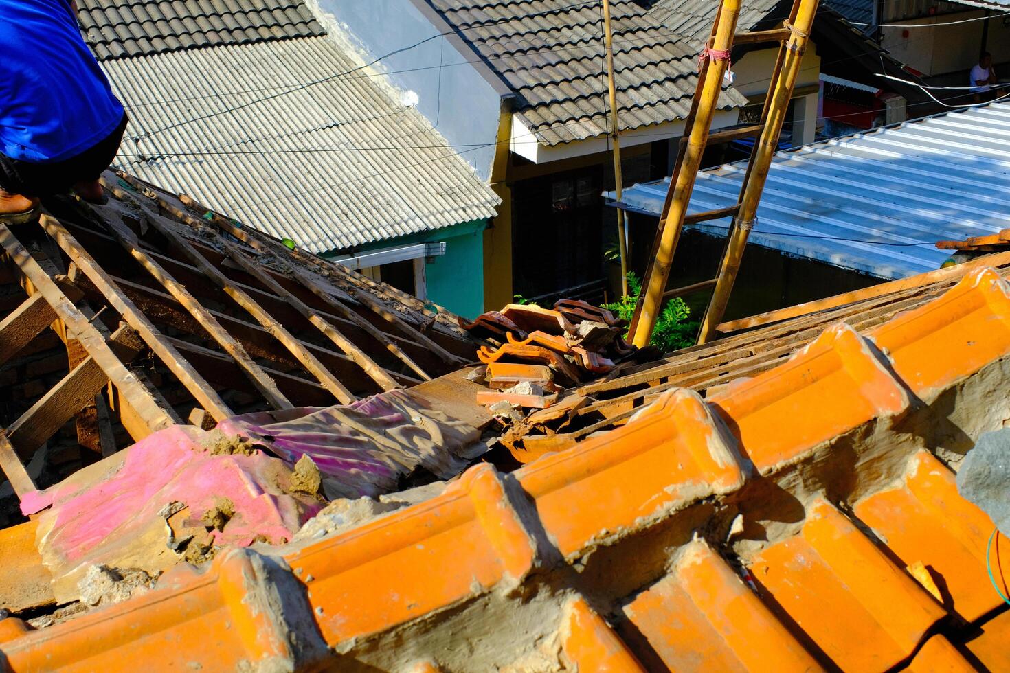 Industrial Photography. Construction works. Photo of dismantling the roof of a house. Dismantling the roof of a house to install a new roof. Bandung - Indonesia, Asia