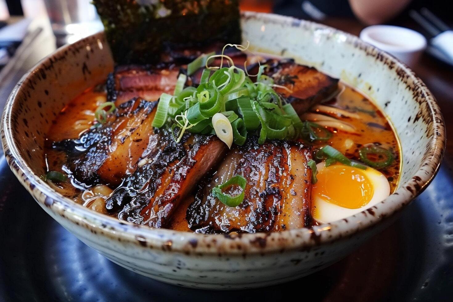 Spicy ramen with tender pork belly Soft Boiled Eggs and Nori photo