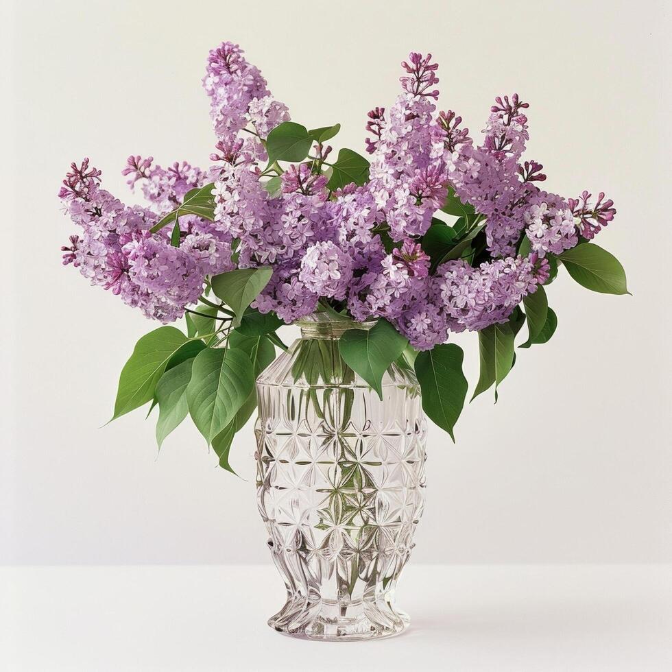 Vintage inspired glass vase. Filled with many fragrant lilacs photo