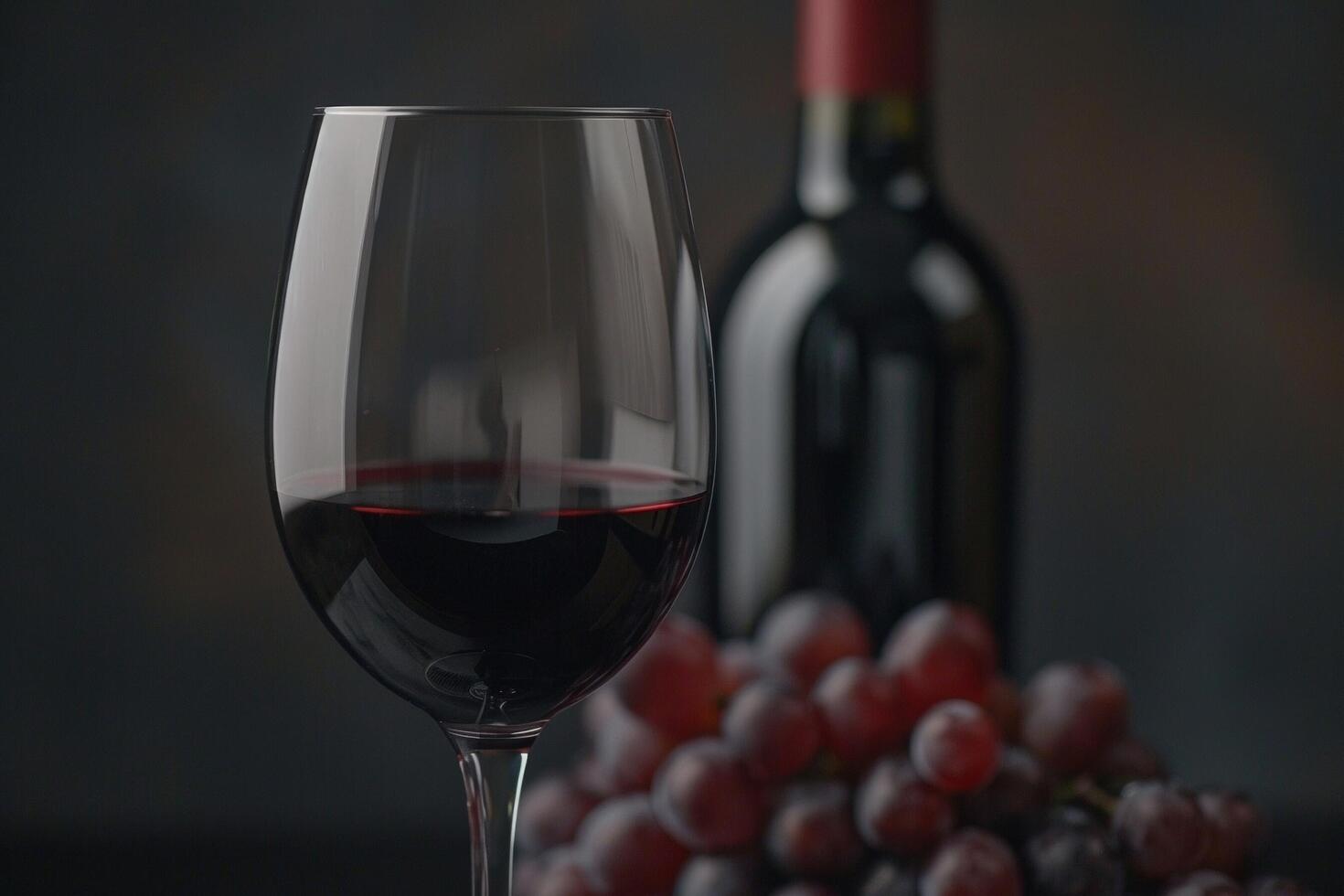 rojo vino y uvas en el antecedentes foto