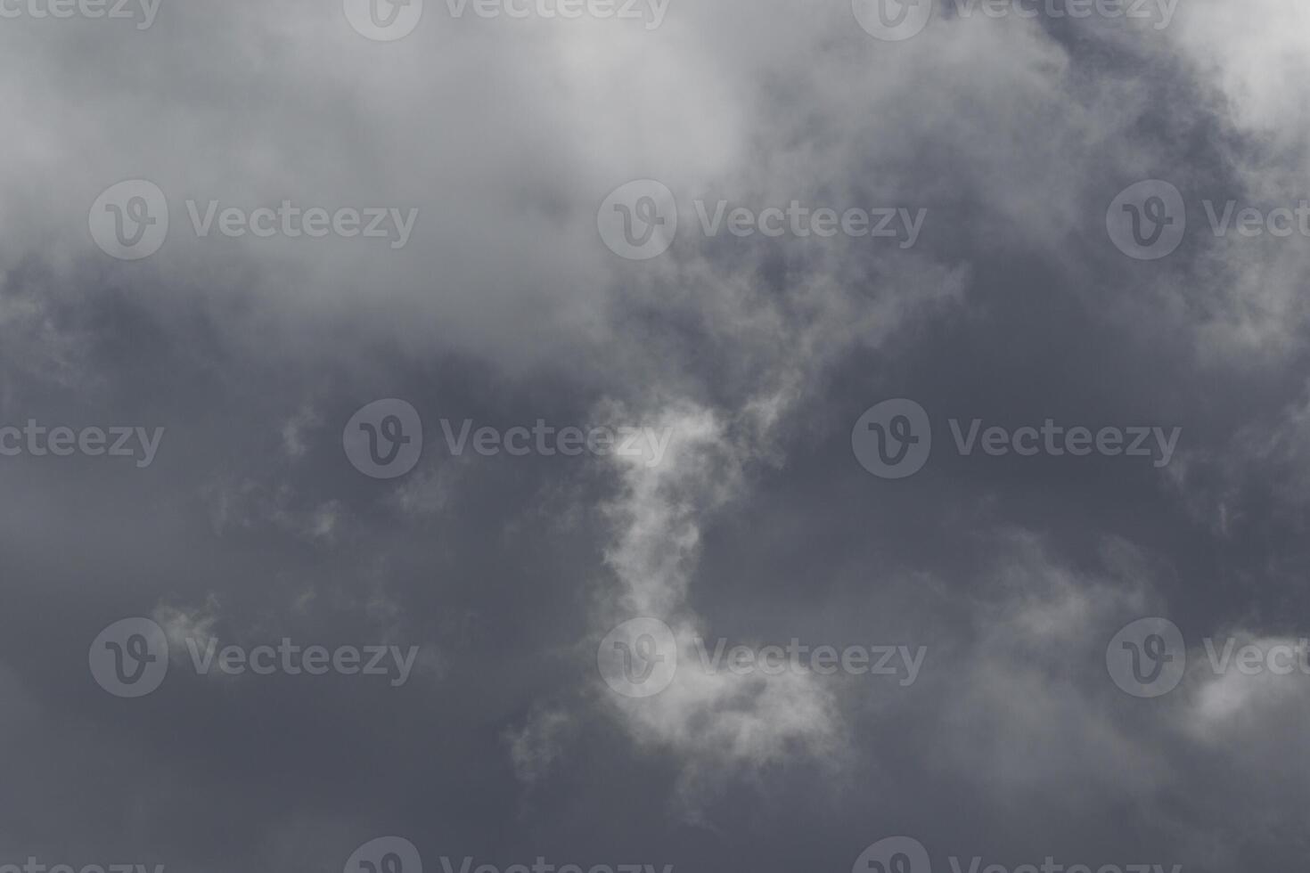 Cloudscape scenery, overcast weather above dark blue sky. Storm clouds floating in a rainy dull day with natural light. White and grey scenic environment background. Nature view. photo